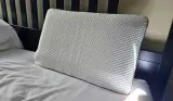 The Emma Adapt Pillow atop our tester's bed in her home