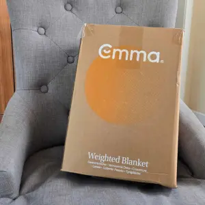 The Emma Hug Weighted Blanket in its box
