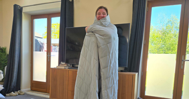 Mumsnet tester Rebecca wraps herself up in the Emma Hug weighted blanket