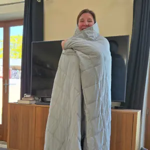Editor Rebecca wrapped up in the Emma Hug Weighted Blanket