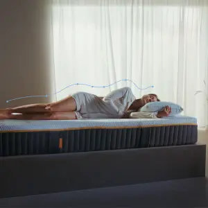 A model sleeps on the Emma Original Elite Mattress