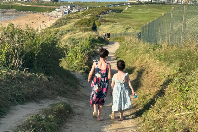 Two sisters strolling down to Fistral Beach from The Esplanade Hotel