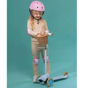 child using EVO mini cruiser scooter with basket