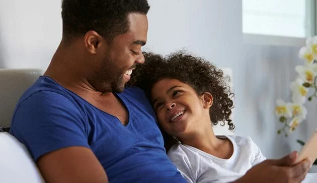 Father and child laughing