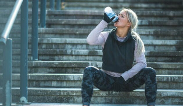 Female runner taking a drink
