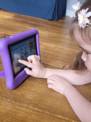 Young girl testing the Amazon Fire 7 tablet