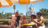 A family dining at the Magic Kingdom Theme Park in Florida