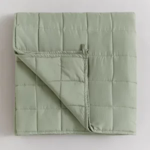 A top view of the Fogarty Calm and Cosy Weighted Blanket with a corner folded