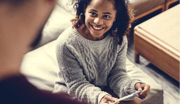 woman holding positive pregnancy test