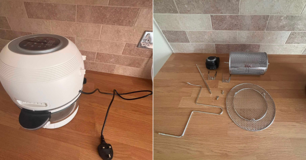 White Fritaire air fryer assembled on a kitchen worktop beside its tumbler basket, air stand, rotisserie parts and grabber