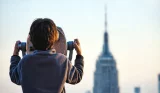 A child viewing the Empire State Building in New York City