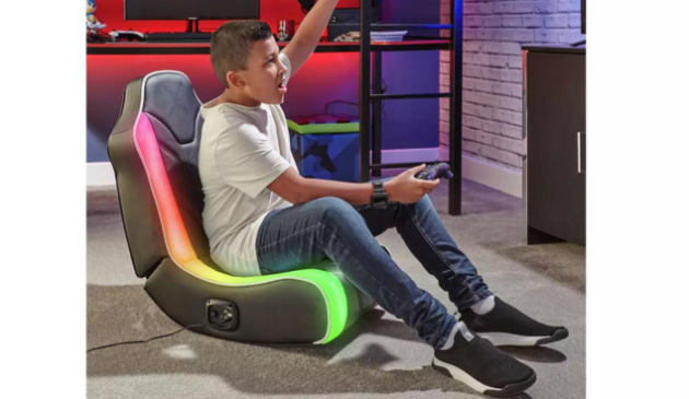 A boy sitting on a gaming chair