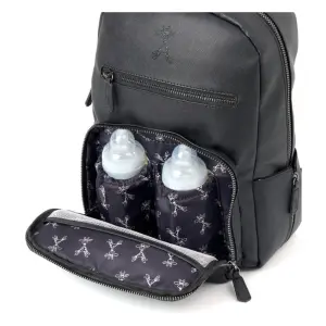 Gigil Bloom Changing Backpack close up of front compartment open with bottles