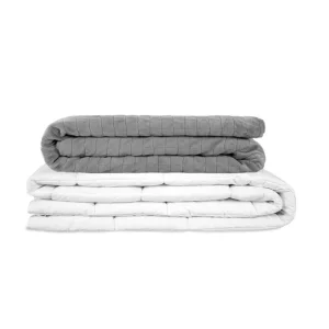A product image of the Gravity® Weighted Blanket folded against a white background