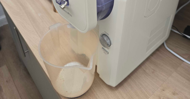 A water jug under the GreenPan Frost ice cream maker