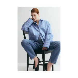 H&M MAMA Slim Mom Ankle Jeans stock image posed by model front view