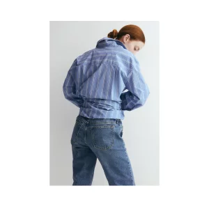 H&M MAMA Slim Mom Ankle Jeans stock image posed by model back view