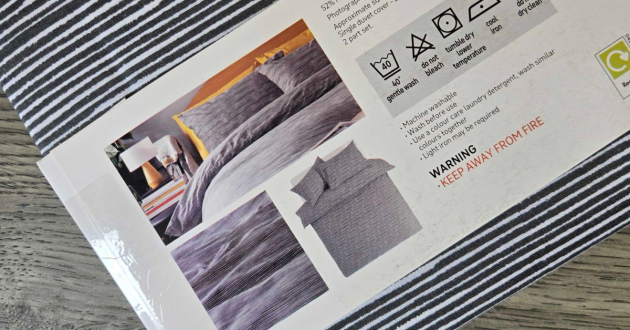 Washing and care instructions on the Habitat Stockholm Stripe Grey Bedding Set packaging