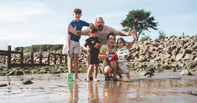 A family enjoying time at the beach while on a Haven holiday.