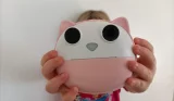 A child holding the HelloBaby Instant Print Camera