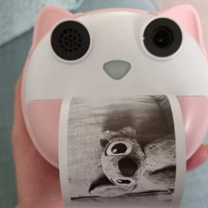 The HelloBaby camera printing a black and white image of Disney character Stitch