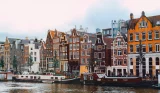 Traditional Dutch buildings by a canal in Amsterdam