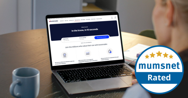 A woman is on her laptop looking at the Autotrader website that's Mumsnet Rated