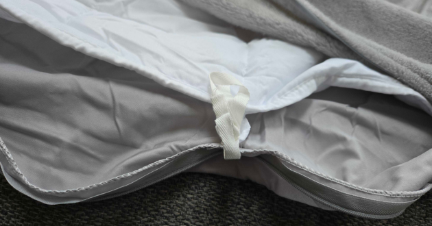 Inside the Next grey weighted blanket to show the secure tie of the inside and cover