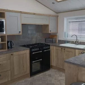 The kitchen in a lodge at Hoburne Bashley holiday park