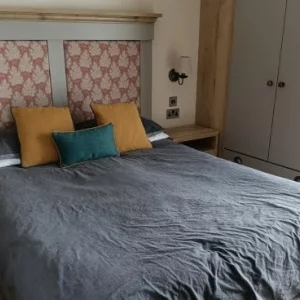 A bedroom in a lodge at Hoburne Bashley holiday park