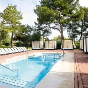 Holiday Village Majorca smaller outdoor pool with shaded loungers