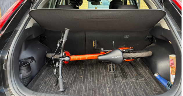 The Hornit HERO pedal bike stored in a Kia Niro boot