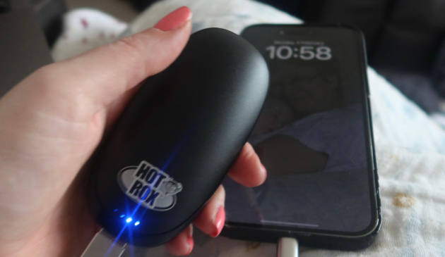 HotRox Electronic Hand Warmer being used as a power bank