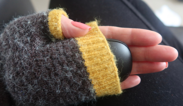 HotRox Rechargeable Hand Warmer in a pair of fingerless gloves