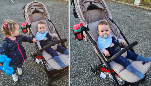Child in Ickle Bubba Aries Stroller with sibling next to buggy
