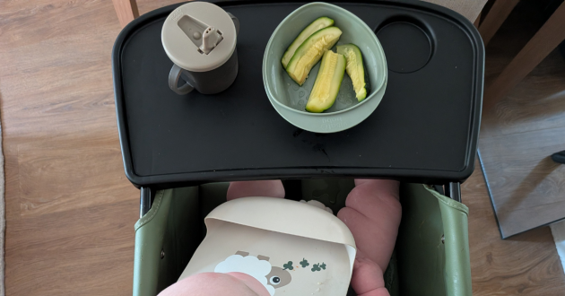 Baby sat in Ickle Bubba Flip Magic Fold Highchair while weaning