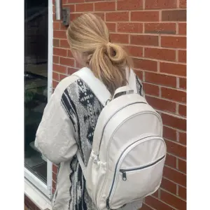 Mum using Ickle Bubba Lyra backpack