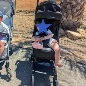 Child in Ickle Bubba Pisces stroller on holiday