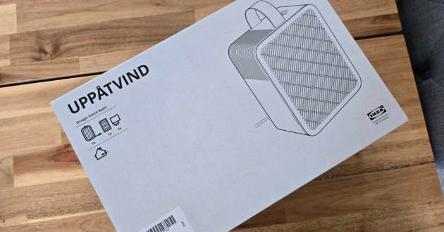 The IKEA UPPATVIND air purifier in its box atop a table