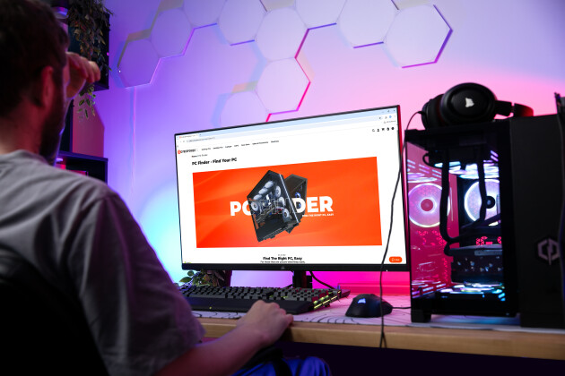 A teenager is looking at CyberPowerPC's website on his computer