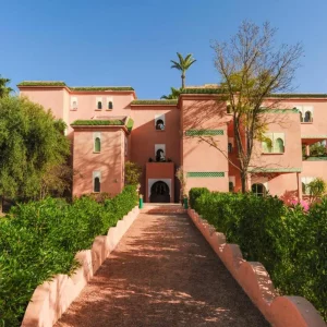 The pink exterior of In Club Palmeraie Resorts in Marrakech