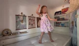 Child testing the Sealy Ortho Bronze Plus mattress