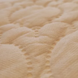 KATY cotbed mattress in testing close up of surface
