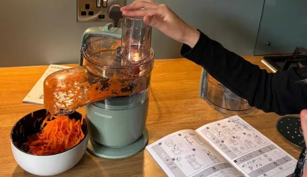 A child processes carrots in the Kenwood MultiPro Go Food Processor