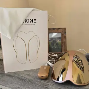 A shot of the KESKINE LED Face mask unboxed on a table