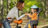 Mum with child on bike with bike seat