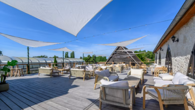 A shaded terrace at Eurocamp La Croix du Vieux Pont