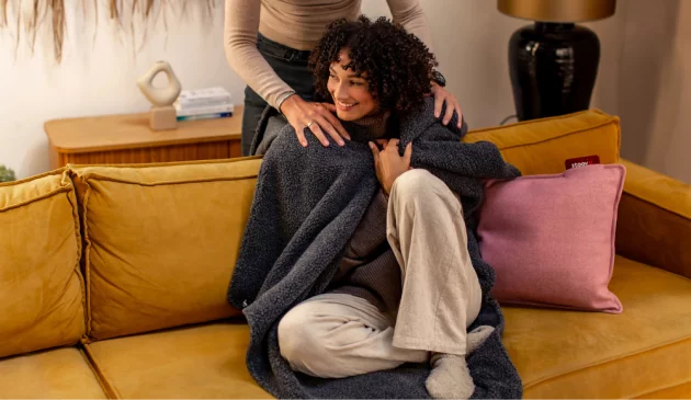 A woman with a Stoov Huge Hug wrapped around her