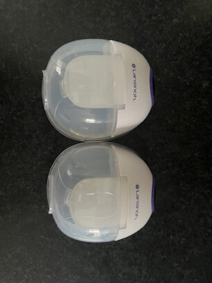 Lansinoh wearable breast pump review image showing pump milk collection cups in testing