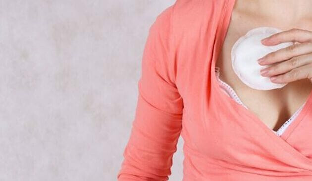 Woman holding breast pad